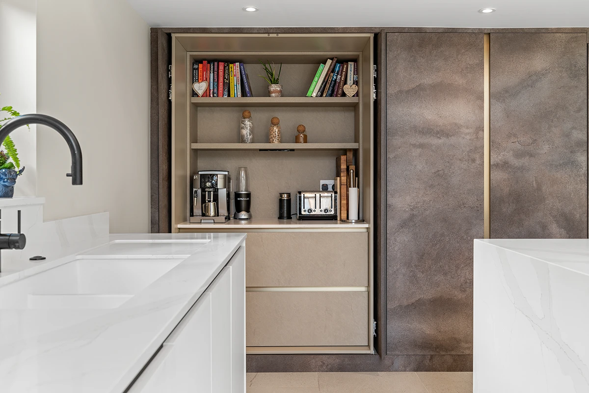 Open display shelves and concealed storage set within textured brown kitchen cabinets